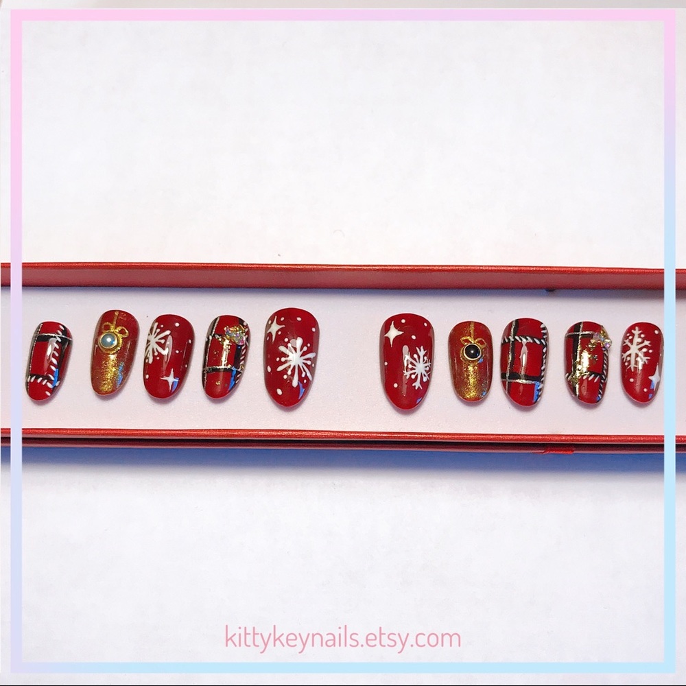 Red Christmas press on nails with snowflakes